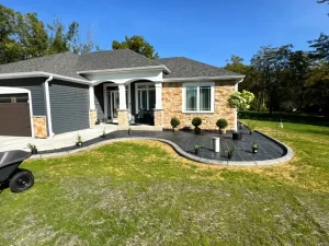 Custom landscaping services in Merton, WI with flower bed planting, mulch installation, and garden design