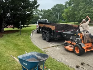Fresh mulch installation around flower beds at a home in Pewaukee, WI