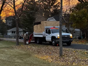 Landscape crew providing seasonal fall clean up and leaf removal in Pewaukee, WI