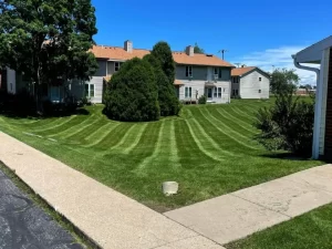 Lawn care crew providing routine lawn maintenance for a home in Eagle, WI