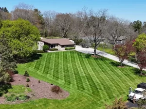 Well-maintained green lawn after professional mowing and trimming in Hartland, WI
